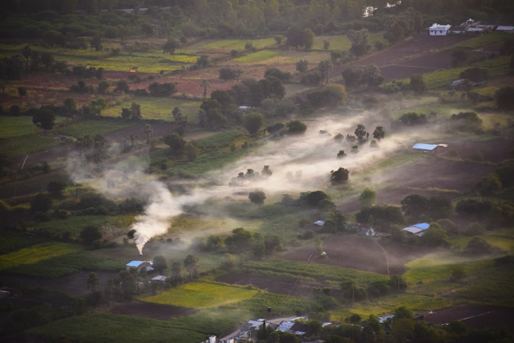 an aerial view of a rural area with houses and trees