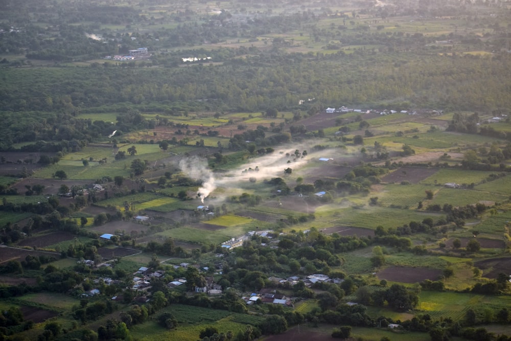 an aerial view of a rural area with houses and trees