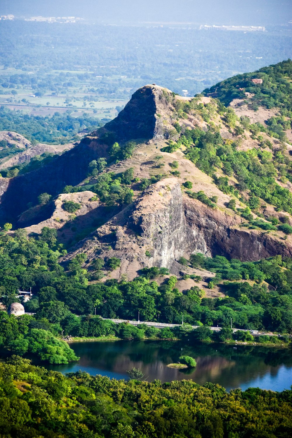 a mountain with a lake in the middle of it