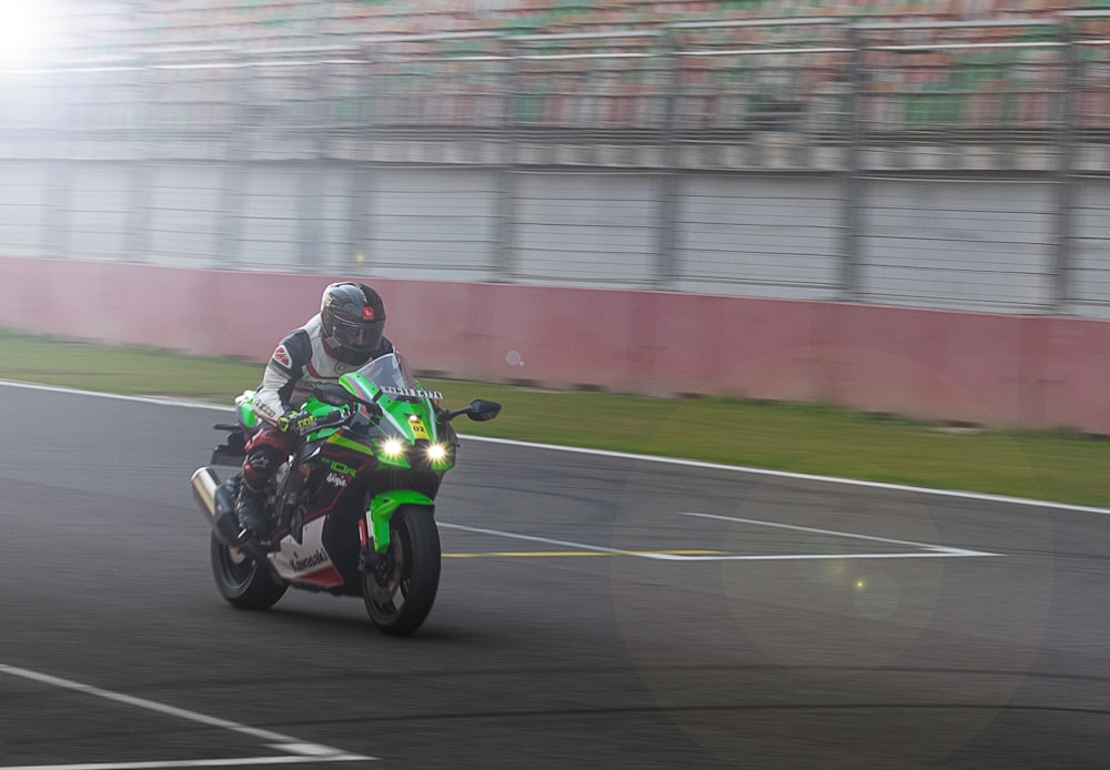 a person riding a motorcycle on a race track