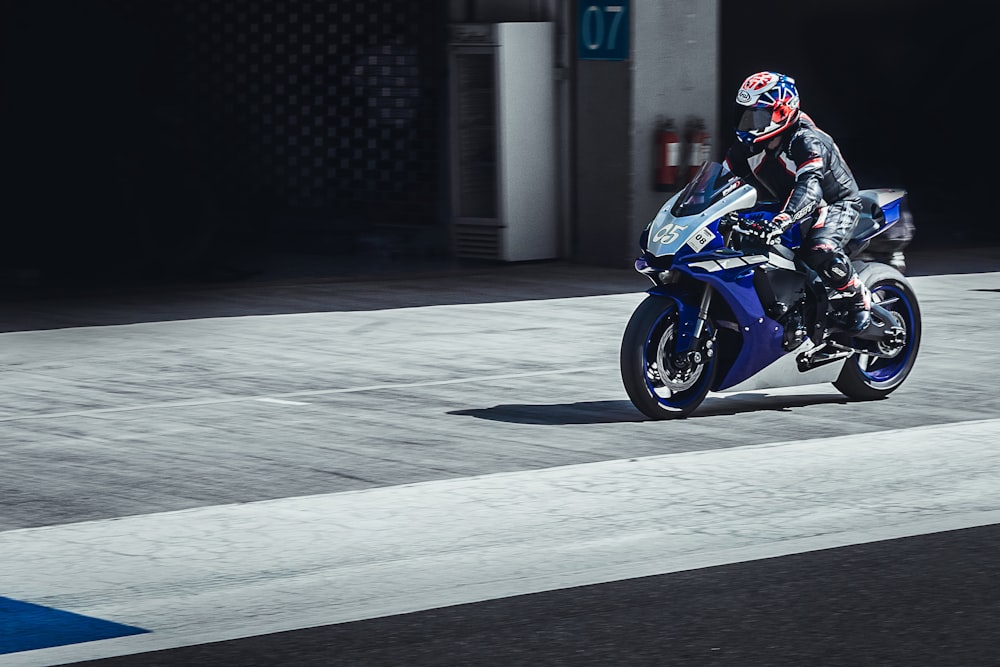 a person riding a motorcycle on a street