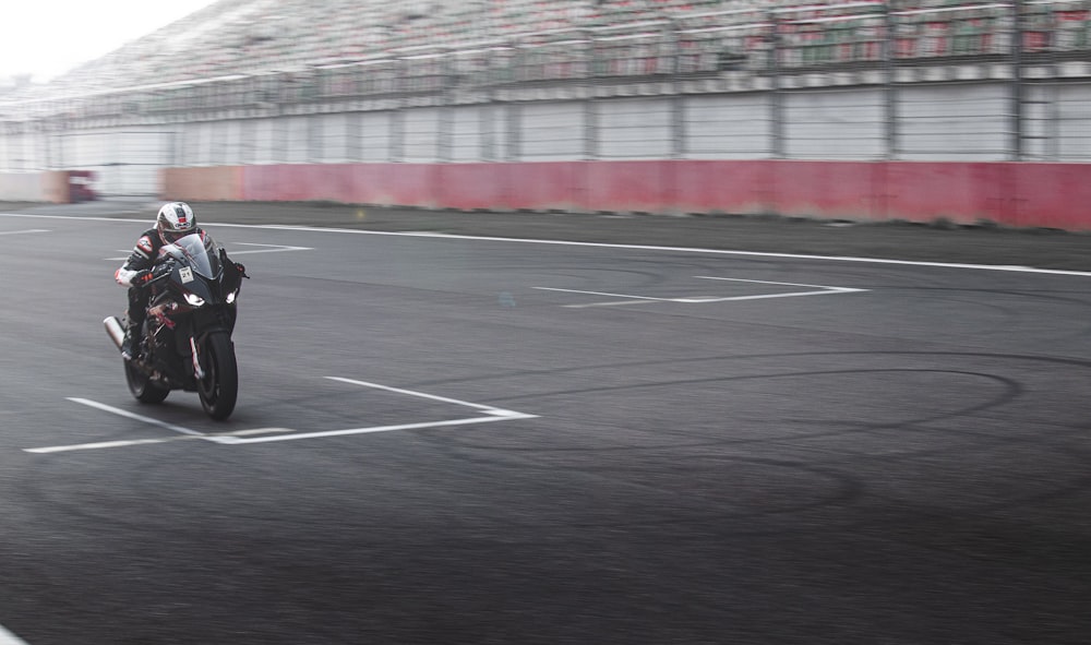 a person riding a motorcycle on a race track