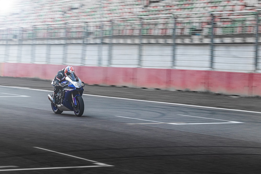 a person riding a motorcycle on a race track