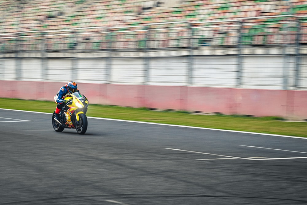 a person riding a motorcycle on a race track