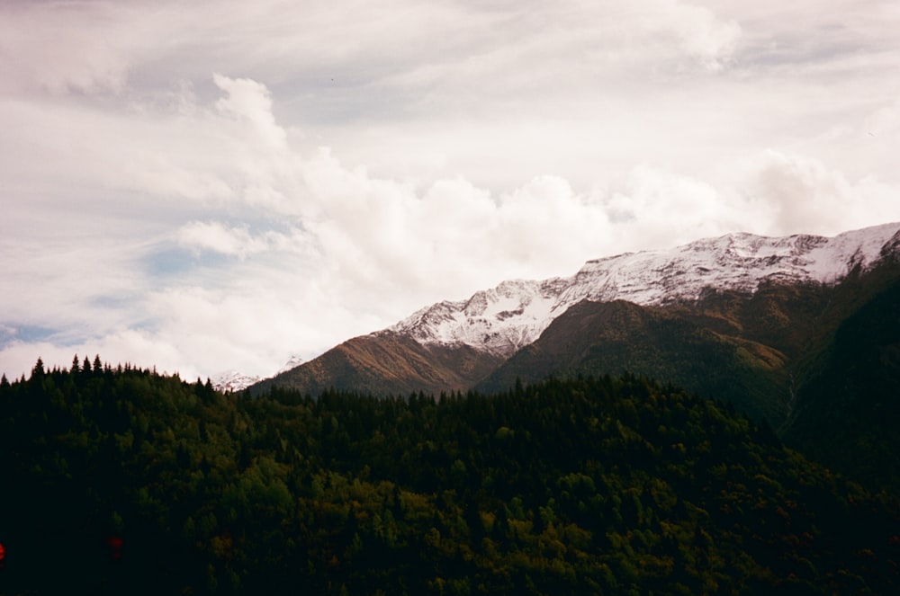 a view of a mountain range with snow on the top