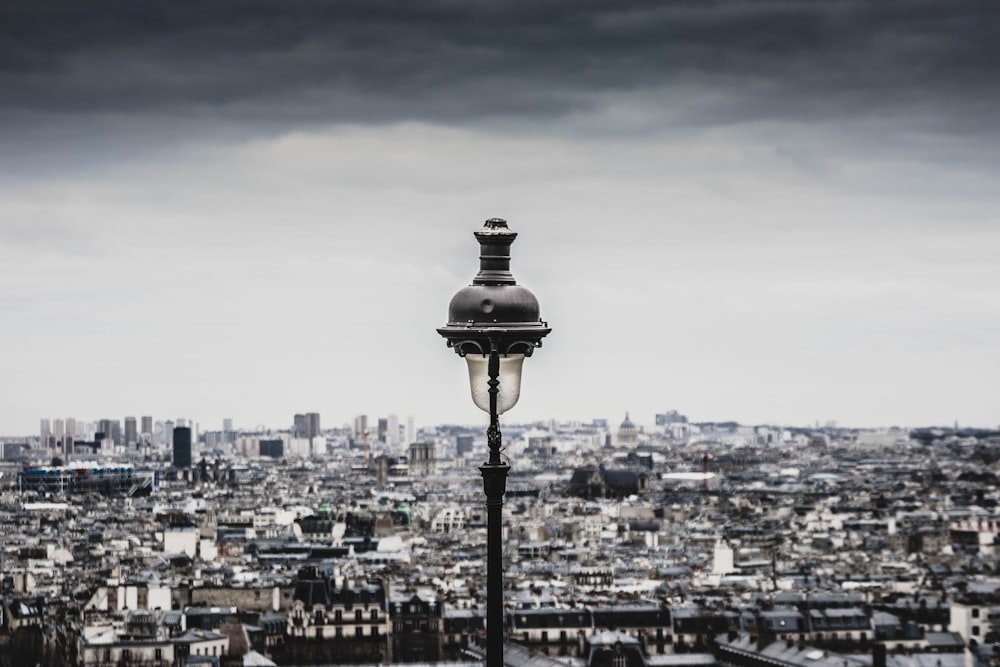 a street light in front of a cityscape