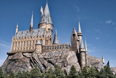 a castle on a hill with a blue sky in the background