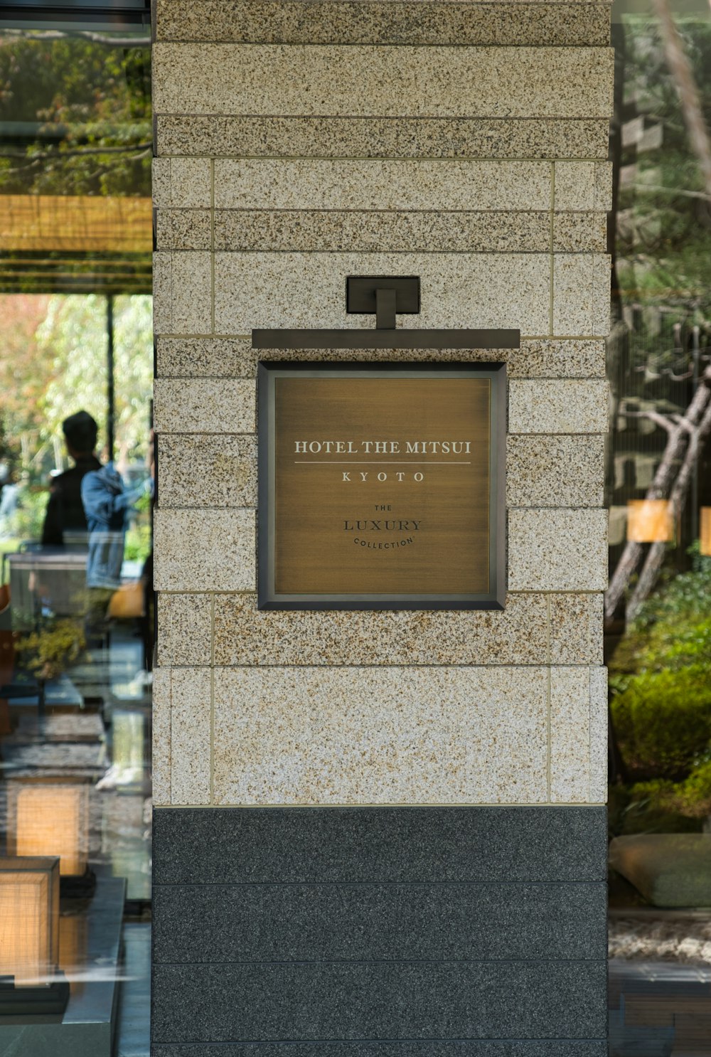 a tall building with a sign on the side of it