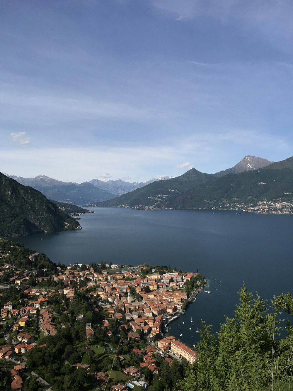 a scenic view of a town and a body of water