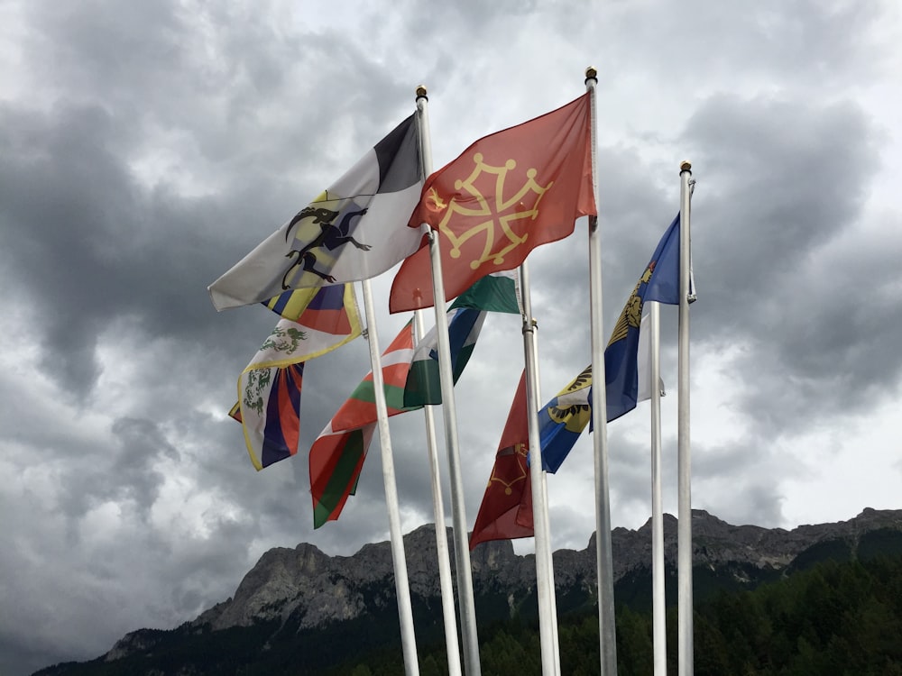 a bunch of flags that are flying in the air