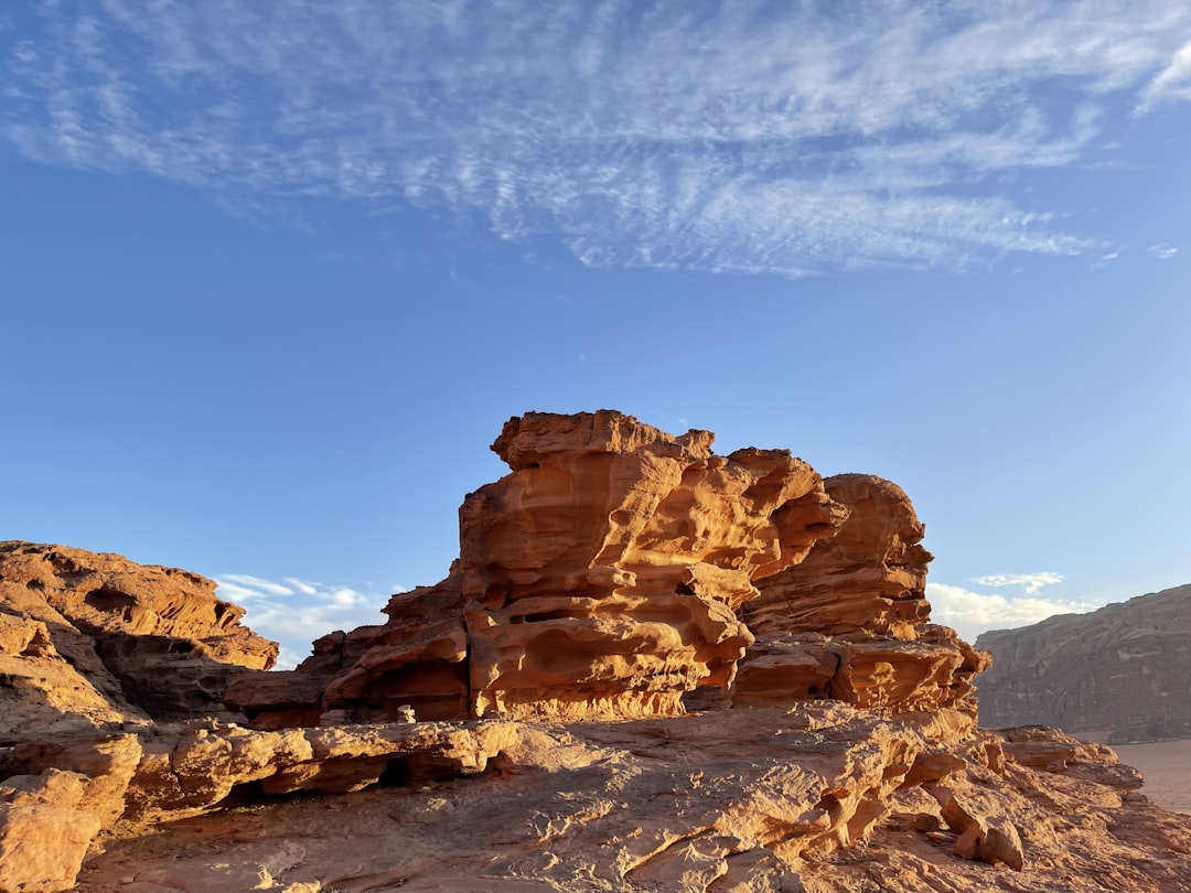 a rocky outcropping in the desert under a blue sky, Incredible rocks of Wadi Rum