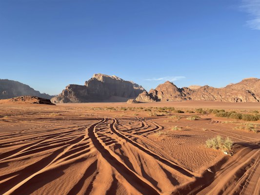 A dirt road in the middle of a desert — Wadi Rum, Jordan