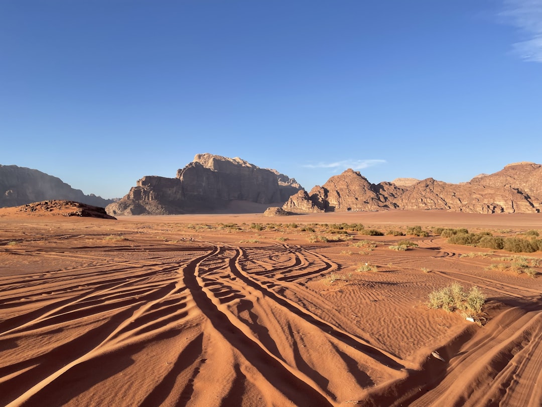 a dirt road in the middle of a desert, Road trip to the Wadi Rum Desert