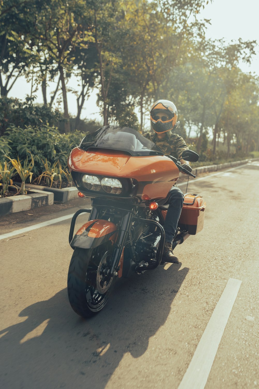 a man riding a motorcycle down a street