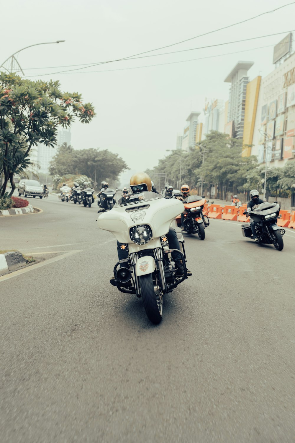 a person riding a motorcycle on a city street