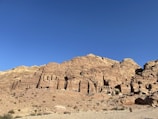 a large rock formation in the middle of a desert