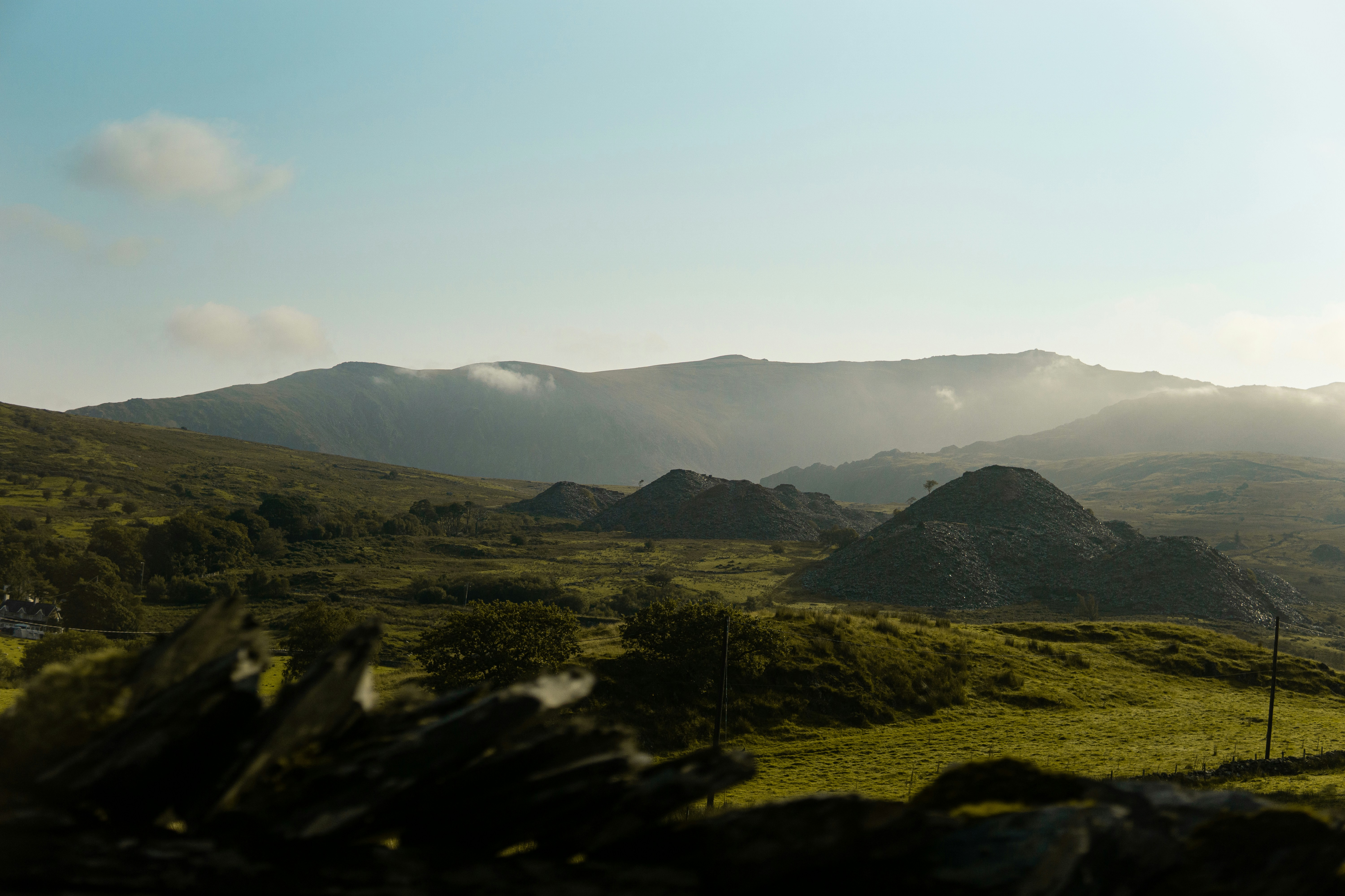 a grassy field with mountains in the background, Snowdonia National Park