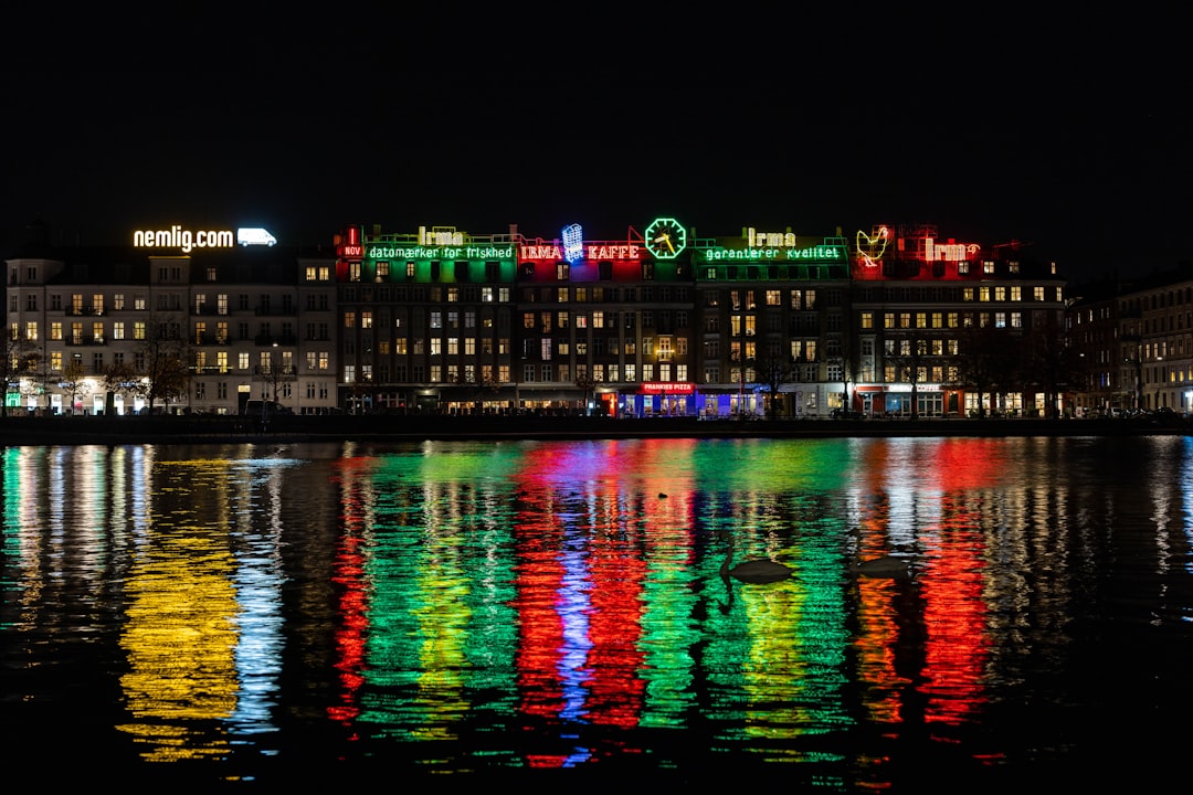 a large building is lit up with christmas lights, copenhangen by night<p></figure>