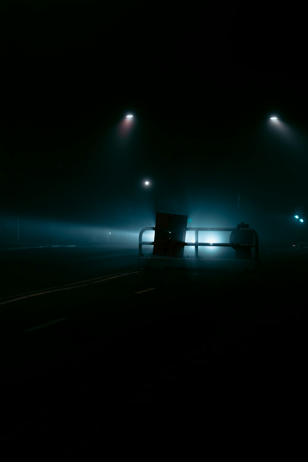 a truck driving down a road at night