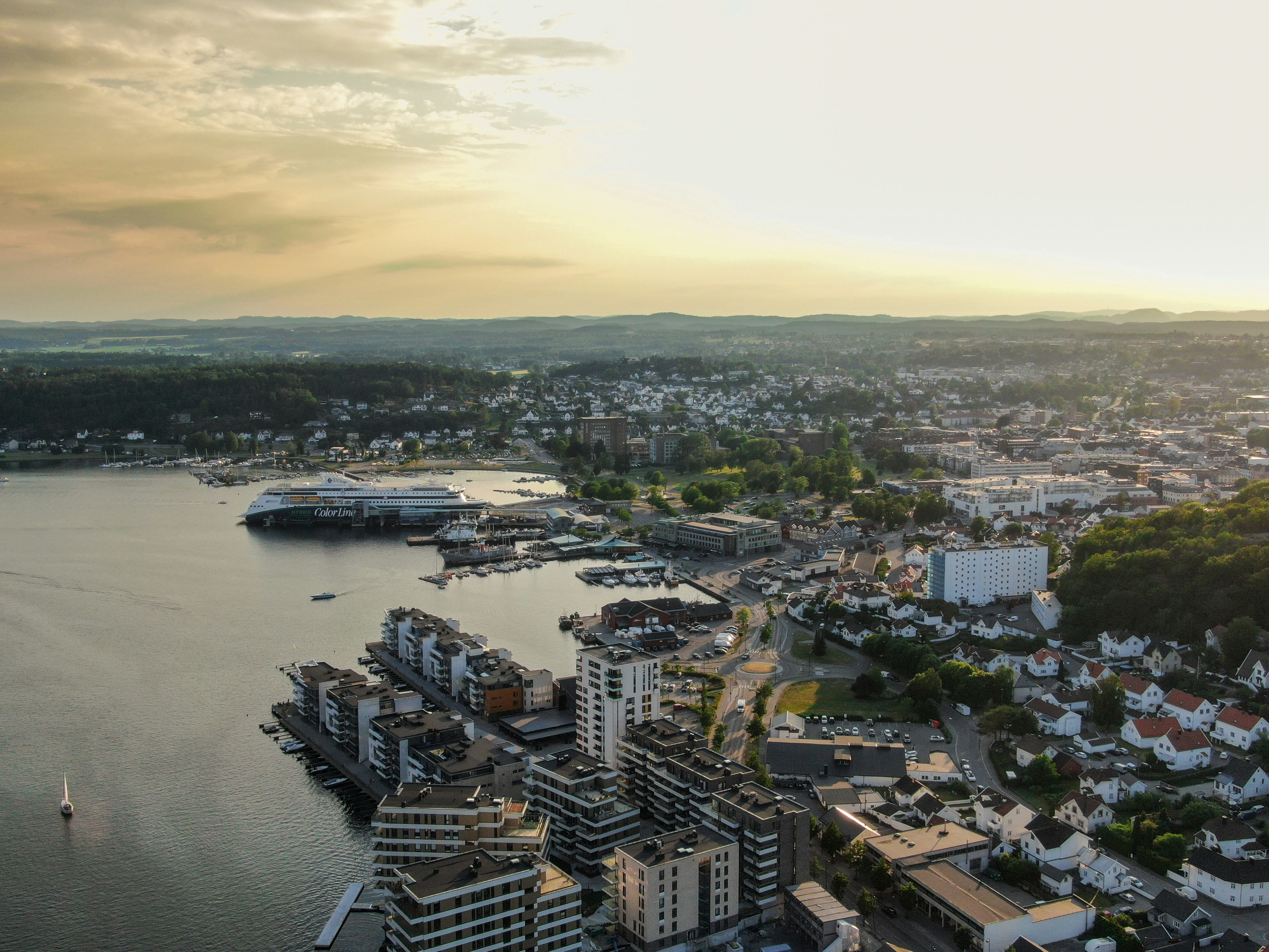 an aerial view of a city and a body of water