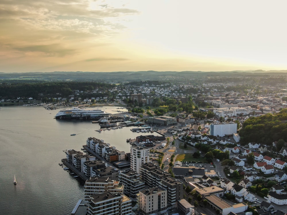 an aerial view of a city and a body of water