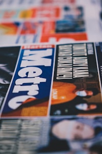 a close up of a newspaper with a picture of a man