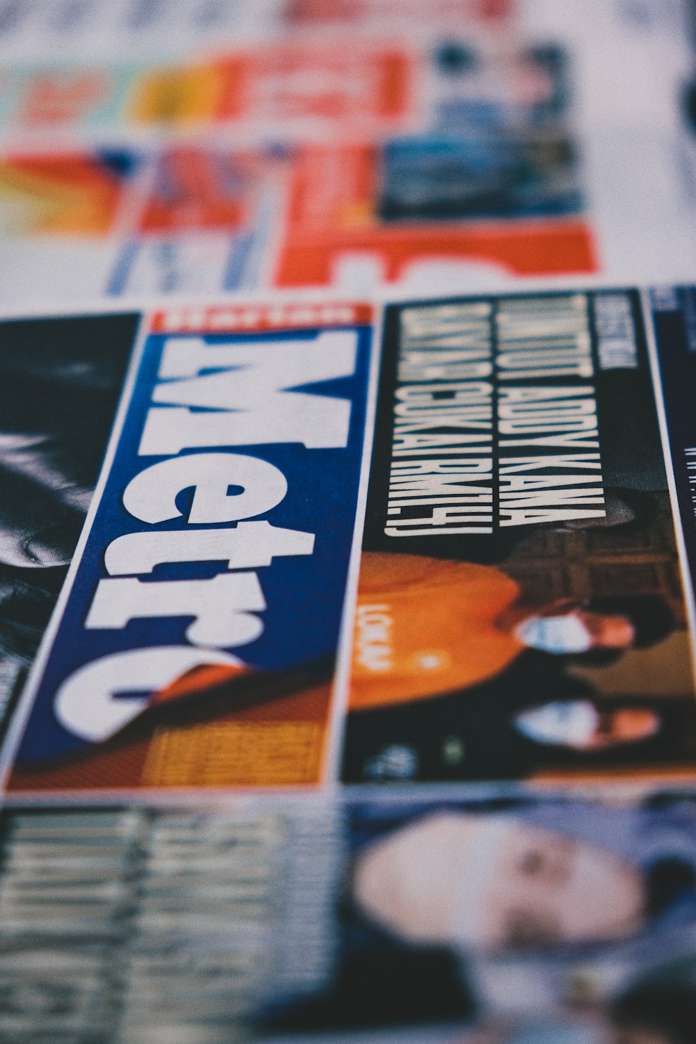 a close up of a newspaper with a picture of a man