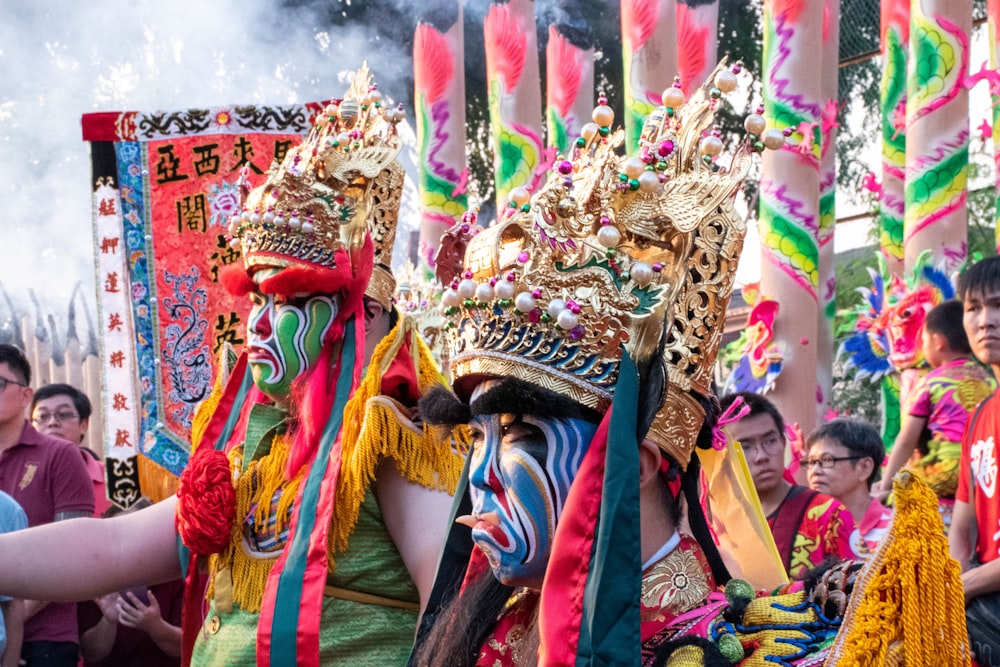 a group of people with colorful costumes and masks