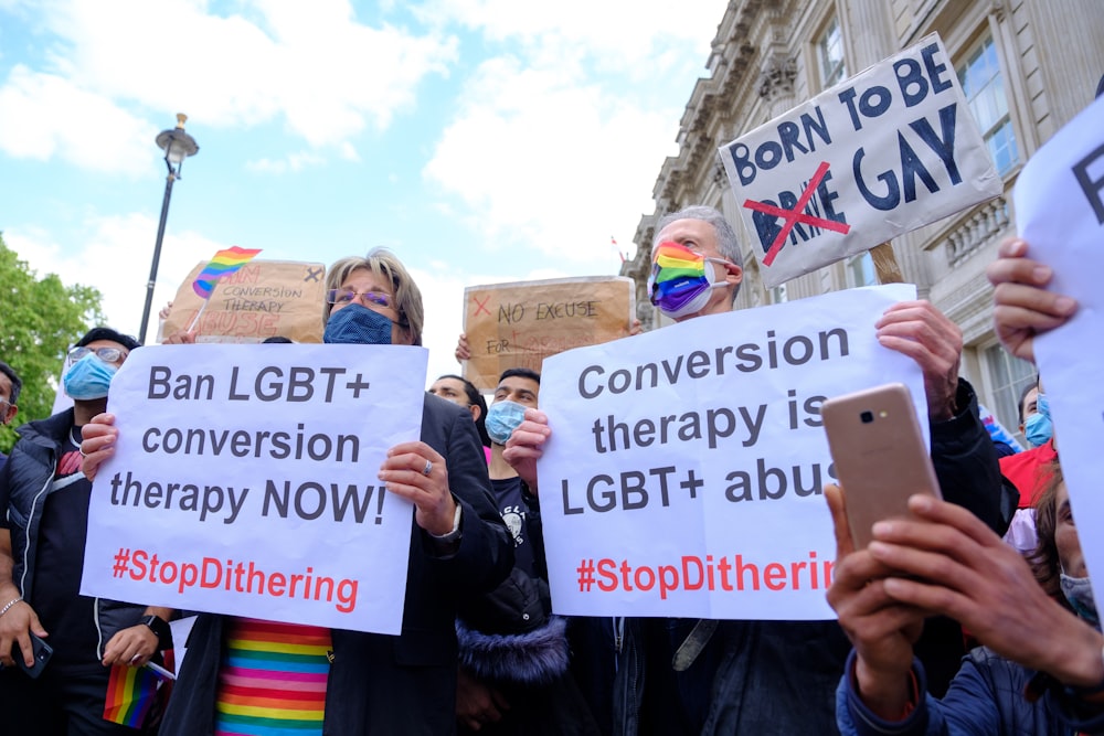 a group of people holding a sign