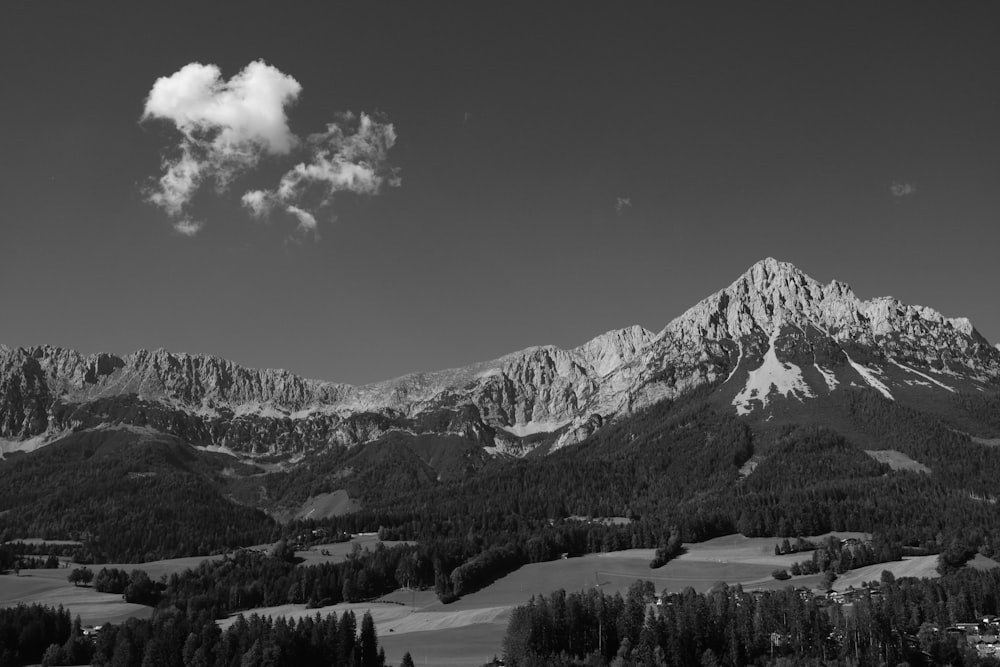 a black and white photo of a mountain range