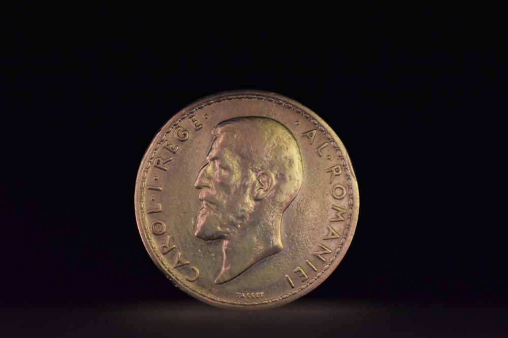 a close up of a coin on a black background