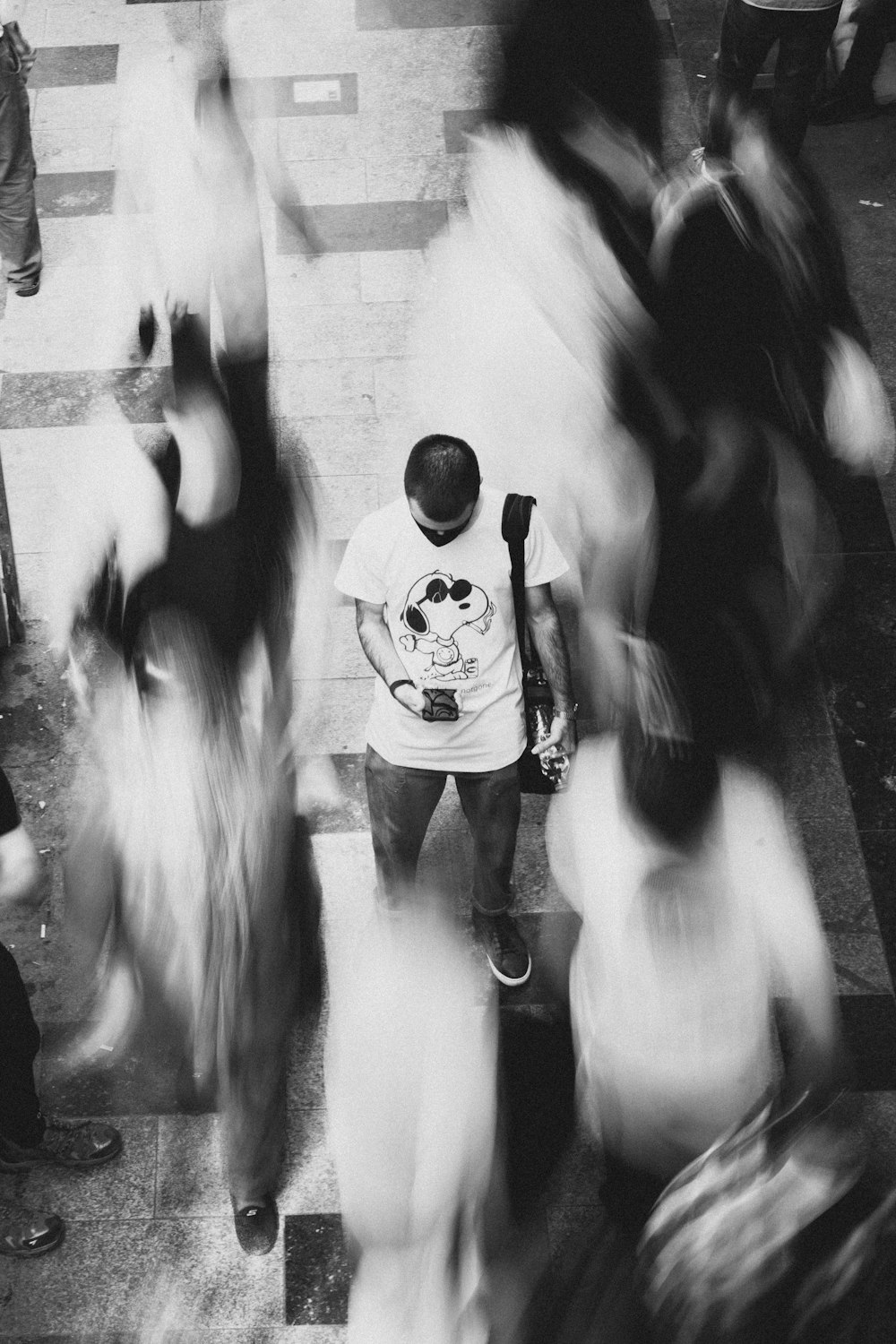 a group of people walking down a street