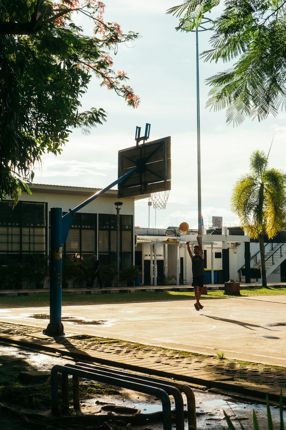 a man is playing basketball on a basketball court