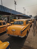 a row of yellow taxi cabs parked next to each other