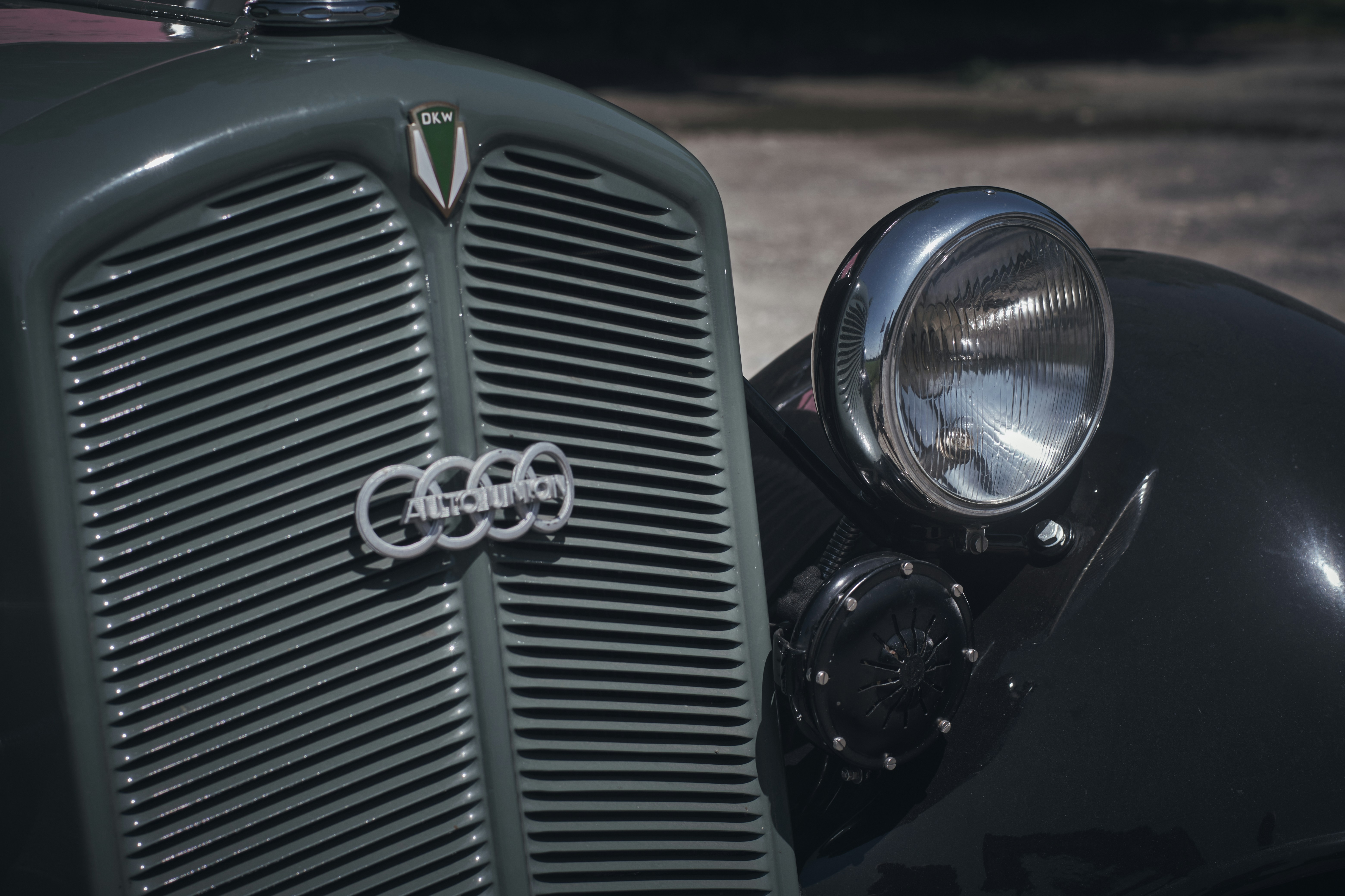 a close up of the front of an old car