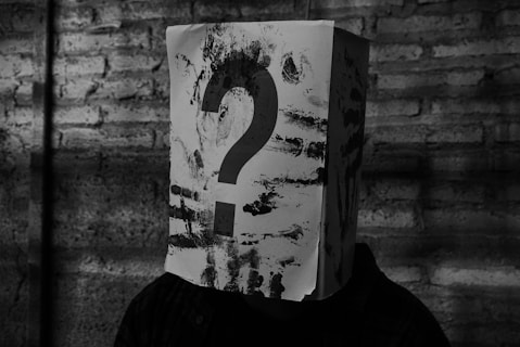 a paper bag with a question mark on it