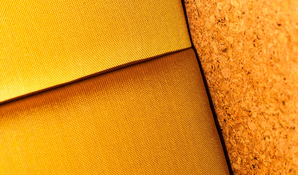 a close up view of a yellow fabric