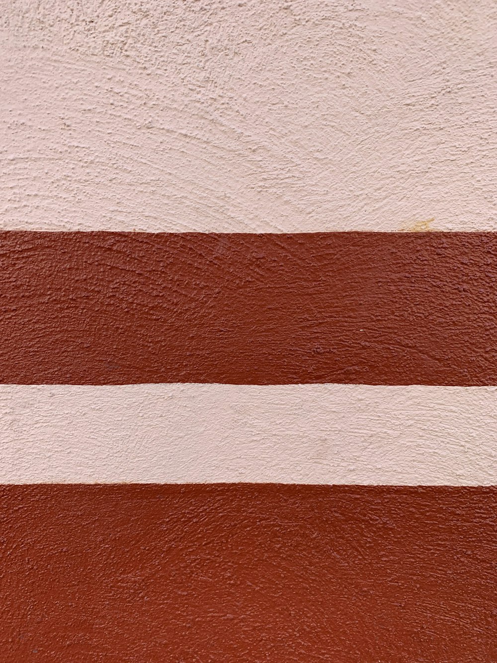 a close up of a red and white stripe on a wall