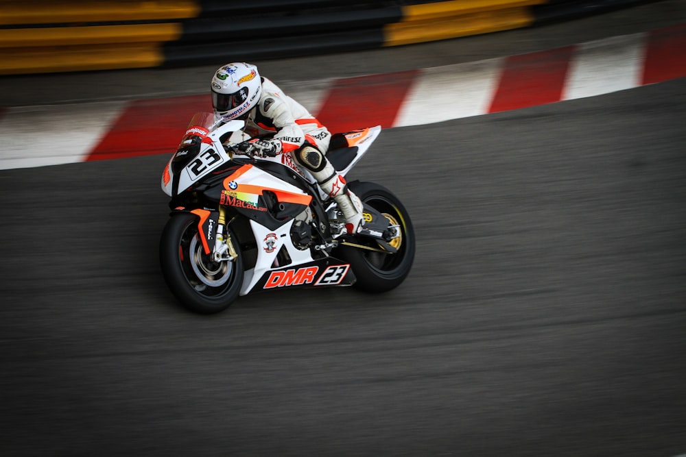 a person riding a motorcycle on a race track