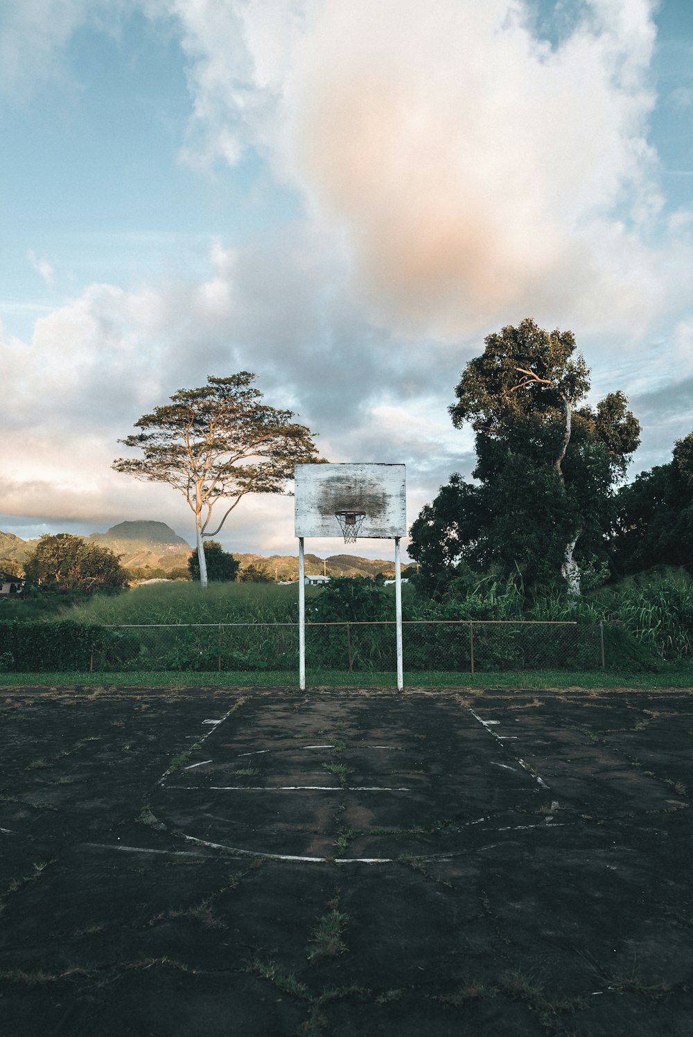 a basketball court with a basketball hoop in the middle of it