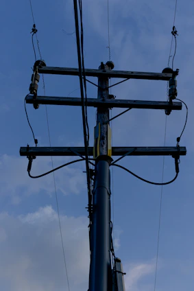 a telephone pole with a bunch of wires attached to it