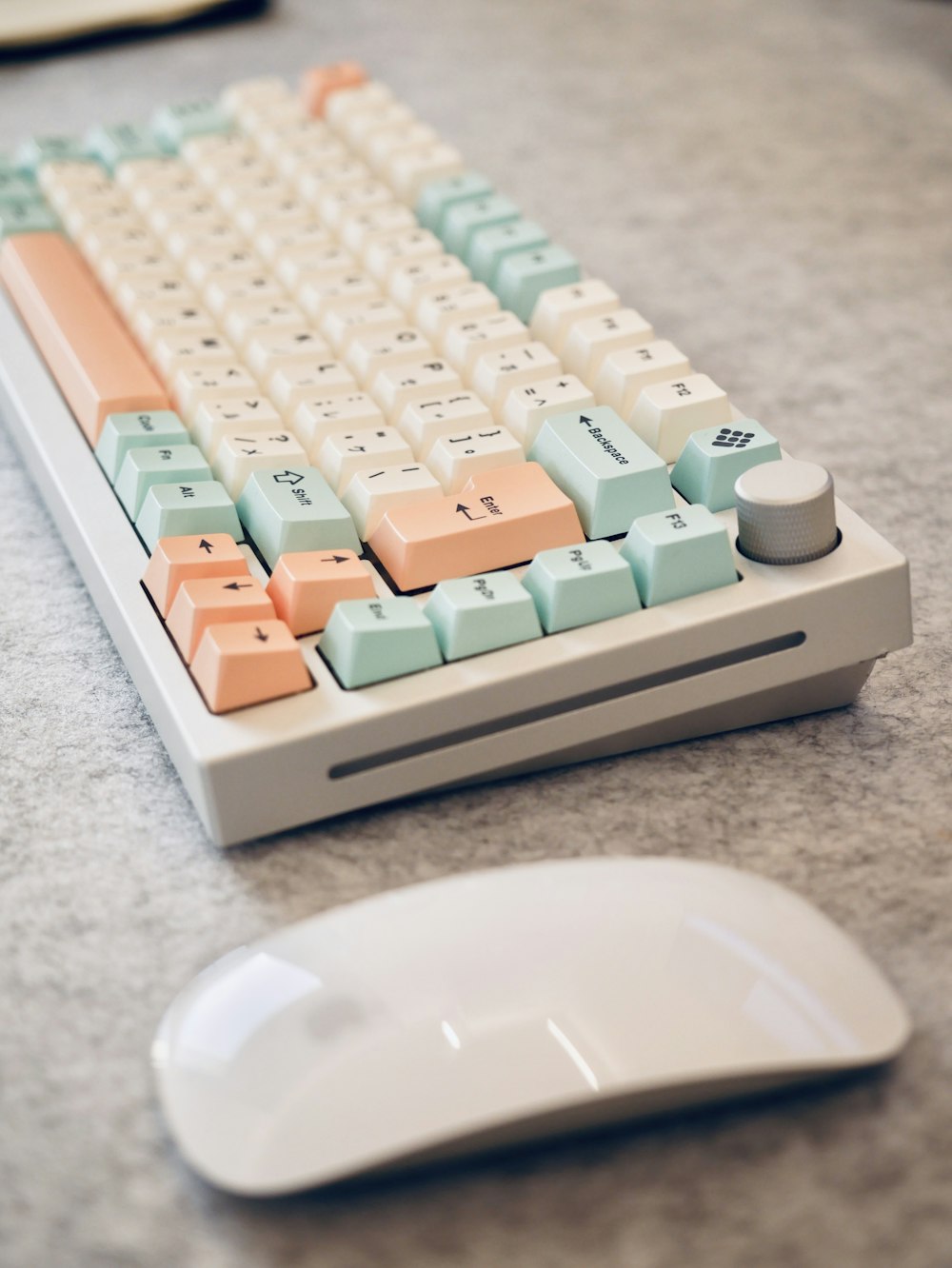 a computer keyboard and mouse on a table