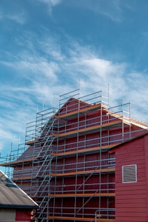 a red building with scaffolding around it