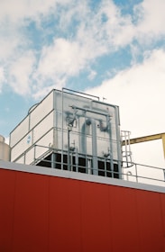 a red building with pipes on top of it