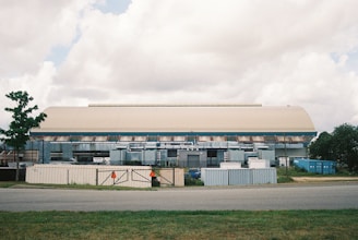 a large building with a gate in front of it