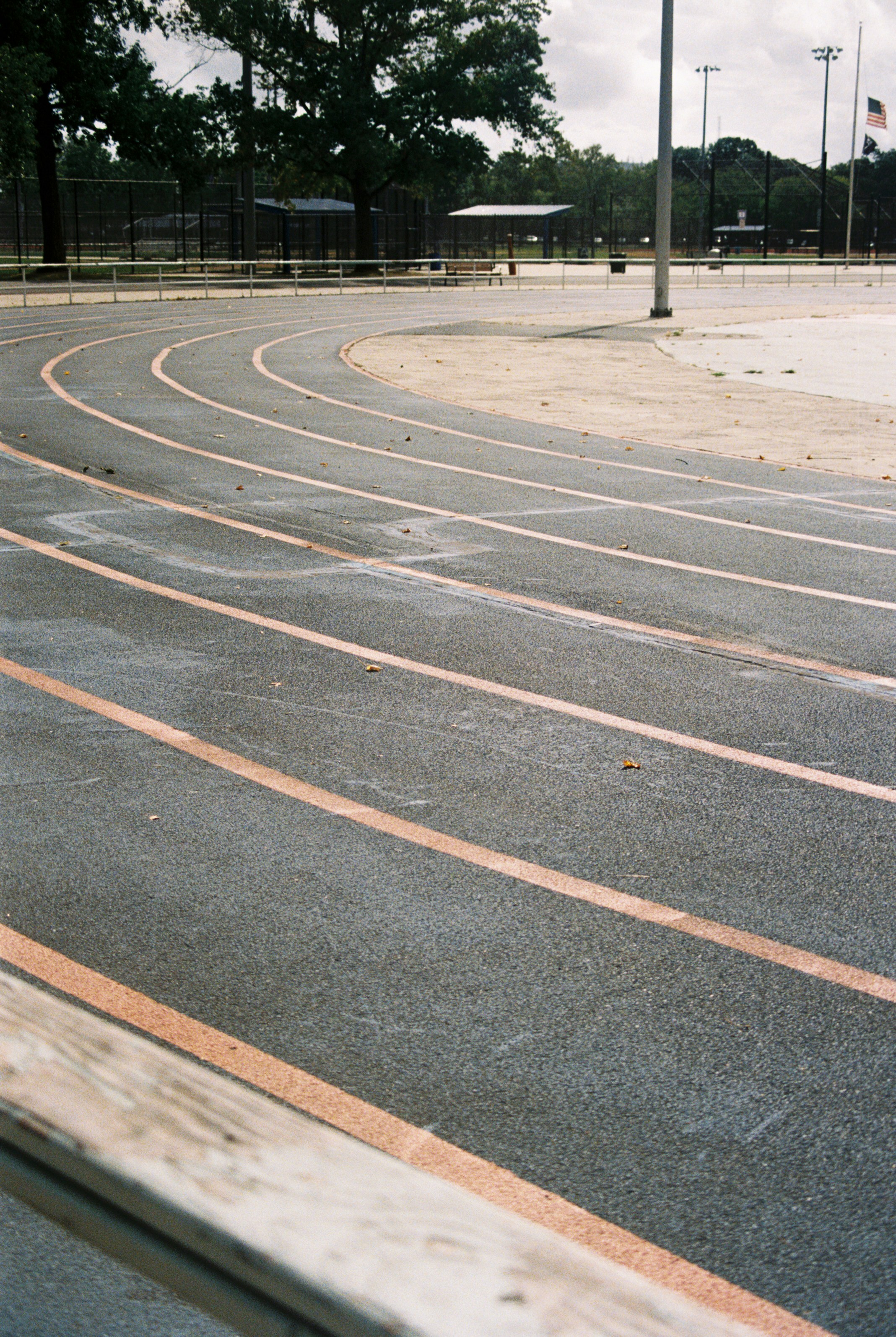 a man riding a skateboard down a curvy road