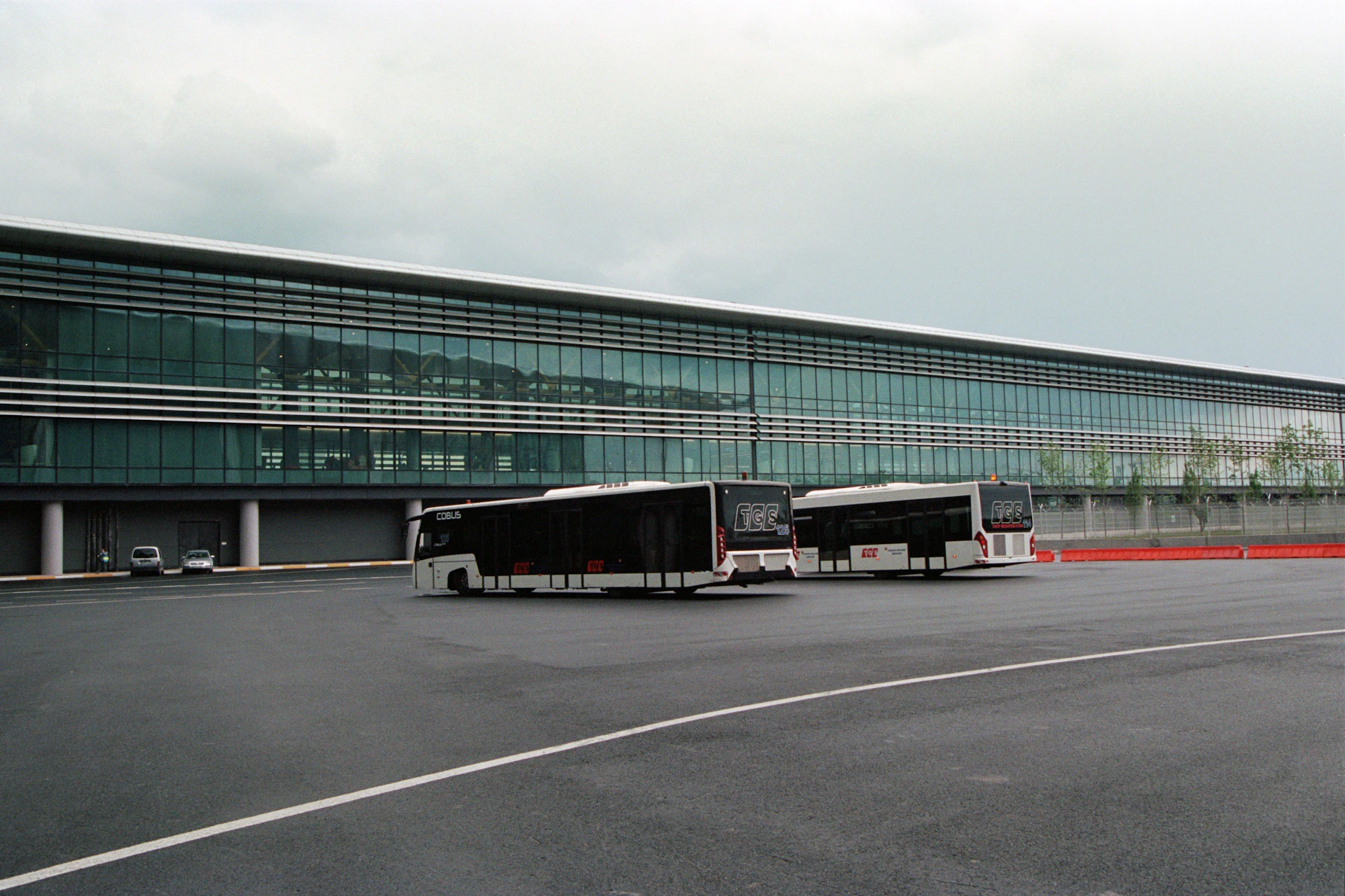 Modern transit terminal building with buses
