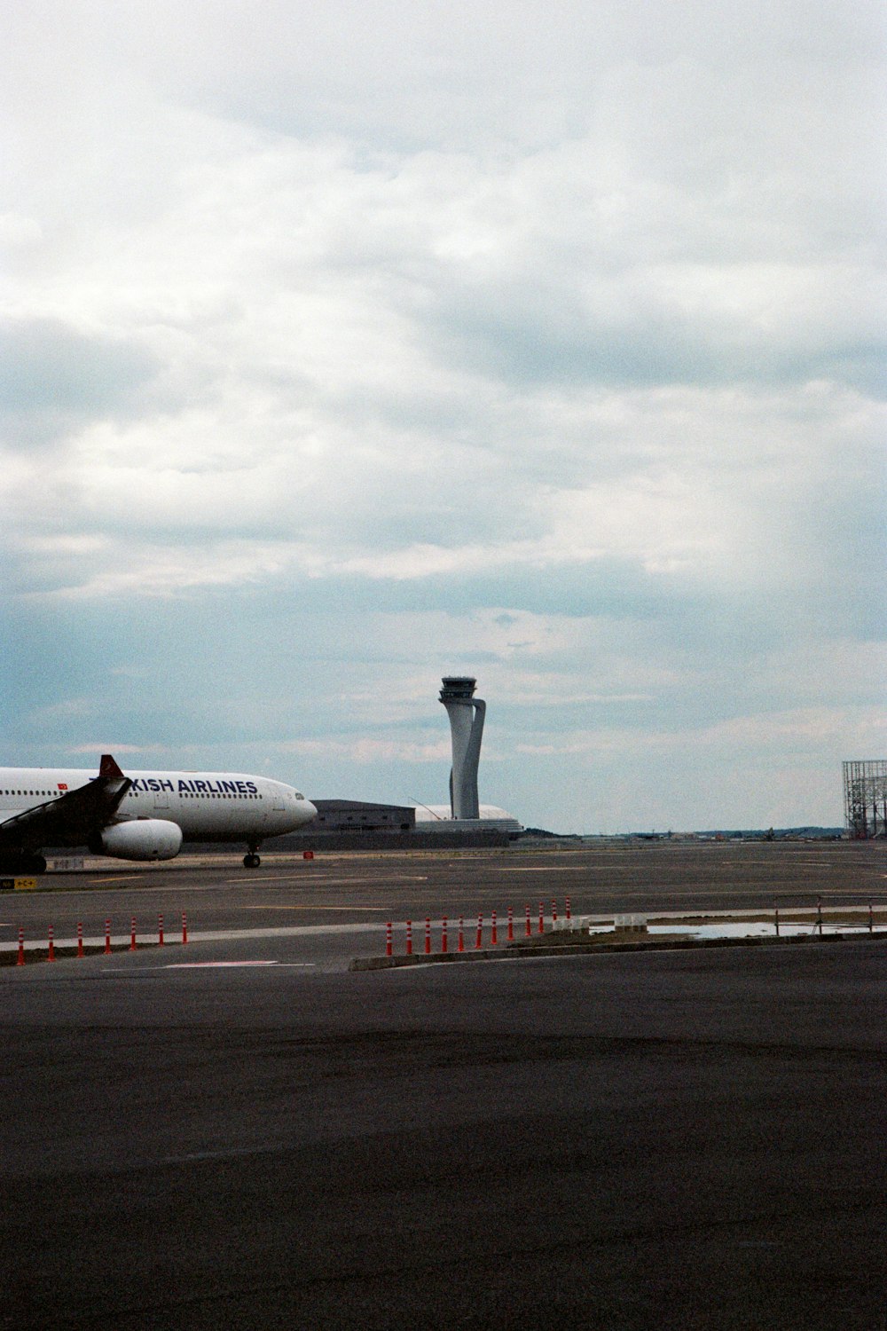 a large jetliner sitting on top of an airport tarmac