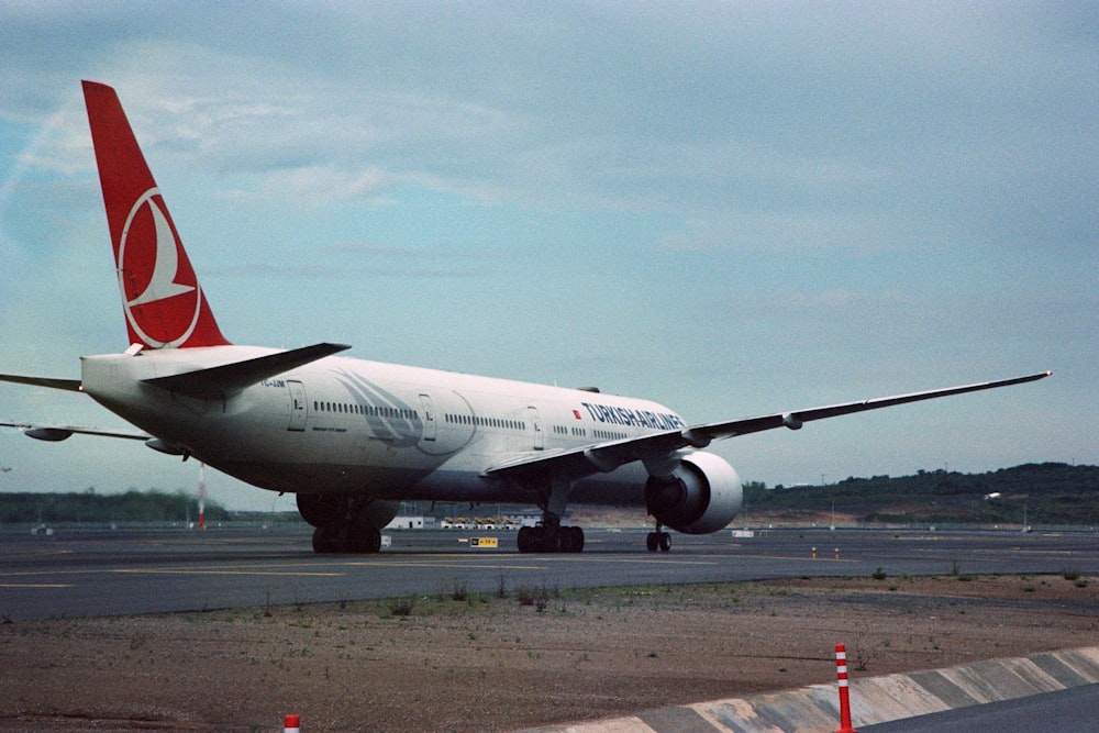 a large jetliner sitting on top of an airport tarmac