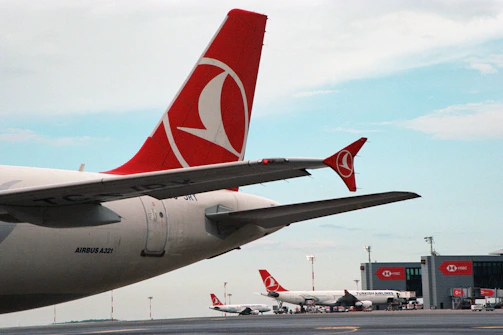 a large jetliner sitting on top of an airport tarmac